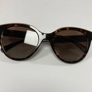 Chanel polaroids sunglasses. Includes Chanel case and box, cleaning cloth.